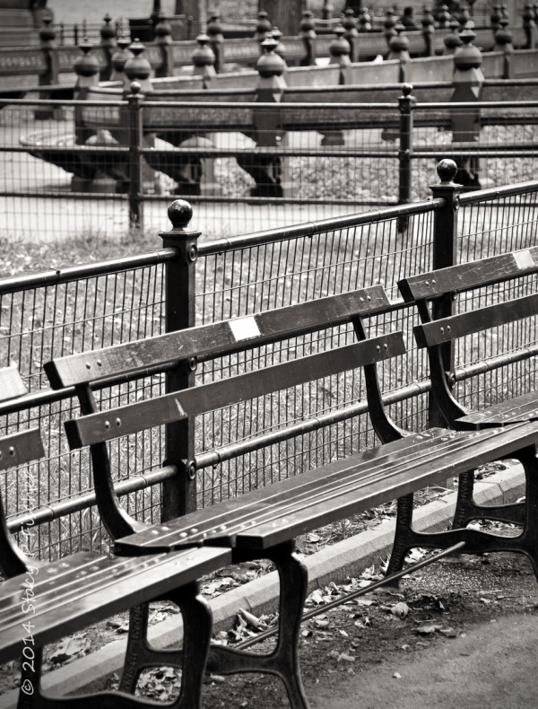 Patterns and angles created by Central Park benches and fences.